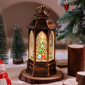 Macro detail of vintage bronze Christmas lantern with LED glowing light and snow globe effect