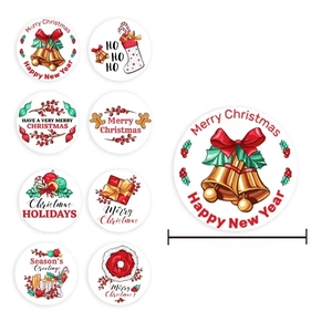2.5cm Christmas stickers roll with 8 festive patterns like bells and gingerbread men