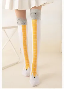Detailed view of novelty chicken feet over-knee socks with yellow graphic and ribbed cuffs