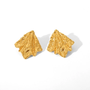Detailed macro view of 18K gold stainless steel earrings with hammered lava texture finish