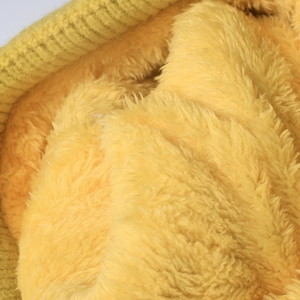 Bright yellow winter knit beanie with thick thermal faux fur lining and ribbed texture
