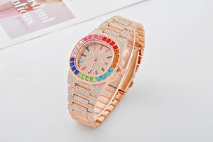Detail of rose gold watch featuring rainbow bezel and full diamond-set metal bracelet