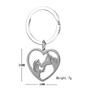 Polished heart-shaped stainless steel keychain featuring a girl and horse silhouette