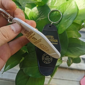 Detail view of retro Hotel California key tags in black and white with metal rings