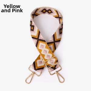 Detail of yellow and pink geometric bohemian strap with golden metal lobster clasps