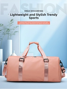 Pink fitness bag detail showing separate shoe compartment and water resistant fabric
