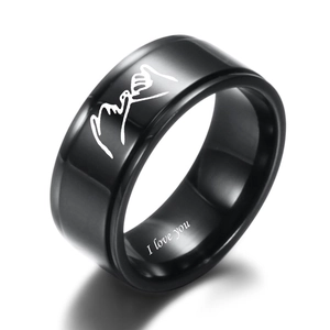 Macro detail of black stainless steel ring with I Love You engraving and pinky swear icon