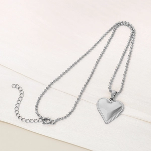 Detail of silver 3D heart pendant on a bead chain with lobster clasp and extender chain