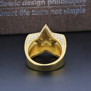 Detailed back view of gold star ring showing hollow structure and pavé zircon stones
