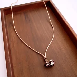 Chinese style gourd pendant necklace with dark enamel animal and flower details