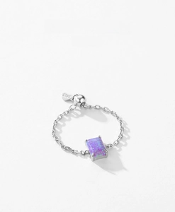 Detail of S925 silver chain ring with purple rectangle opal and adjustable heart charm