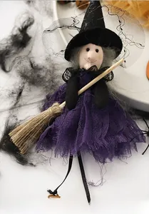 Close-up of Halloween flying witch doll with purple gauze skirt and mesh pointed hat