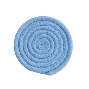 Top view of light blue woven cotton coaster showing detailed braided rope texture