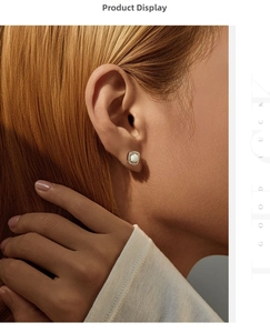 Elegant square silver earrings with synthetic opal center and pavé crystals on ear