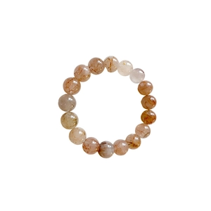 Natural red rutilated quartz beaded bracelet with polished round gemstones on white background