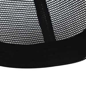 Detail of black trucker hat showing breathable polyester mesh structure and stitching