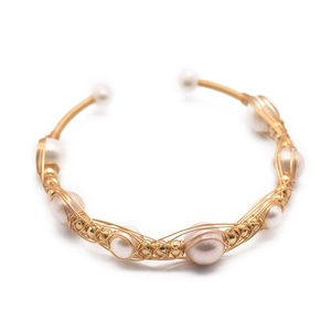 Handmade gold plated bangle with natural freshwater pearls in a vintage wrap design