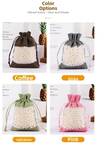 Detail of drawstring linen and organza bags in four colors with pearl filling