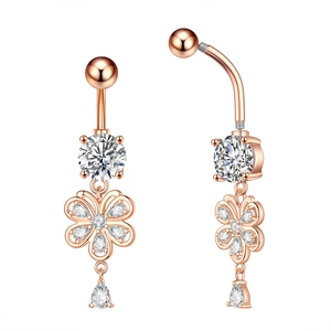 Detail of rose gold flower belly ring with white zircon stones and screw interface