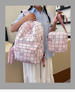 Three-piece school bag set with pink plaid backpack, crossbody bag, and pencil case