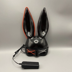 Detail of black LED rabbit mask with orange and white cold light wires and battery pack