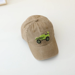 Kids khaki baseball cap featuring green truck embroidery with curved brim style