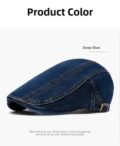 Detail of blue denim flat cap showing orange stitching and bronze adjustable buckle