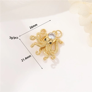 Macro view of 14K gold octopus pendant featuring a large zircon and realistic tentacle detail