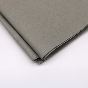 Detailed texture of folded grey tissue paper for craft and gift wrapping on white background