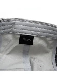 Detailed close-up showing the 100% cotton material care label and internal stitching