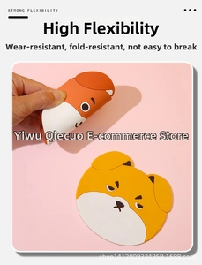 Detail of flexible yellow Shiba Inu silicone coaster being bent to show durability