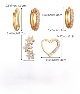 Detailed view of golden copper earring set with heart and flower studs weighing 3.1g
