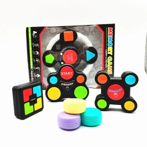Detail of electronic memory game toy with colorful glowing buttons and digital score display