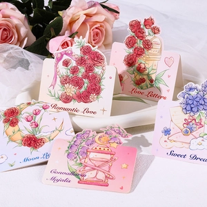 Macro detail of romantic floral gift cards with elegant illustrations and love phrases