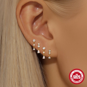 S925 sterling silver gold stud earring set with zircons shown on model ear