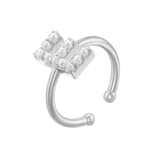 Detailed shot of a silver open ring featuring small pearls in a rectangular arrangement