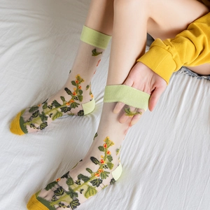 Sheer glass silk socks with yellow floral embroidery and green ribbed cuffs for women