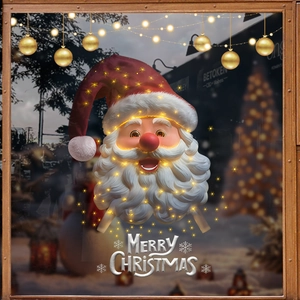 Illuminated Santa Claus LED window decoration with warm yellow lights and festive design