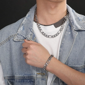 Men's titanium steel NK 1:3 curb chain necklace and bracelet set styled on a model