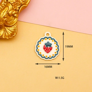 Macro detail of strawberry enamel alloy charm showing 19mm height and 16mm width dimensions