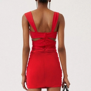 Red backless cutout swimsuit featuring ruched waist details and elegant 3D floral accents