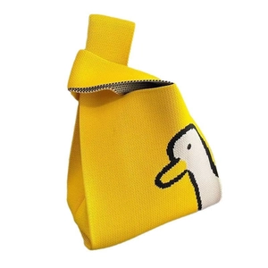 Chic yellow knit tote bag with a cute white duck pattern and a knot handle design