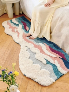 Detail of 3D textured wavy floral bath mat with plush high-low pile for bathroom