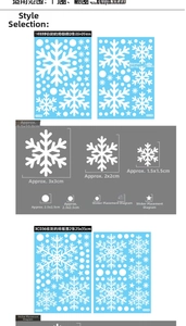 Detail view of blue and white snowflake window stickers in various sizes and patterns