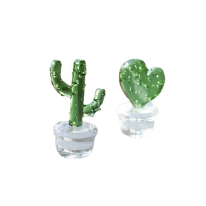 Handmade Japanese glass cactus and heart ornaments with transparent bases on white background