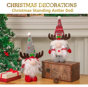 Christmas reindeer gnomes with knitted hats and antlers standing by a white fireplace
