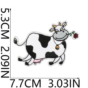 Detailed view of cute cow embroidery patch with dimensions 5.3cm x 7.7cm in black and white