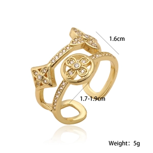 Detail view of gold-plated ring showing 1.6cm height and hollow flower design
