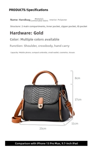 Detail view of mini two-tone crossbody bag with black snake pattern and brown handle
