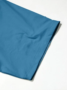 Macro detail of dark blue cotton t-shirt sleeve with high-quality double needle stitching